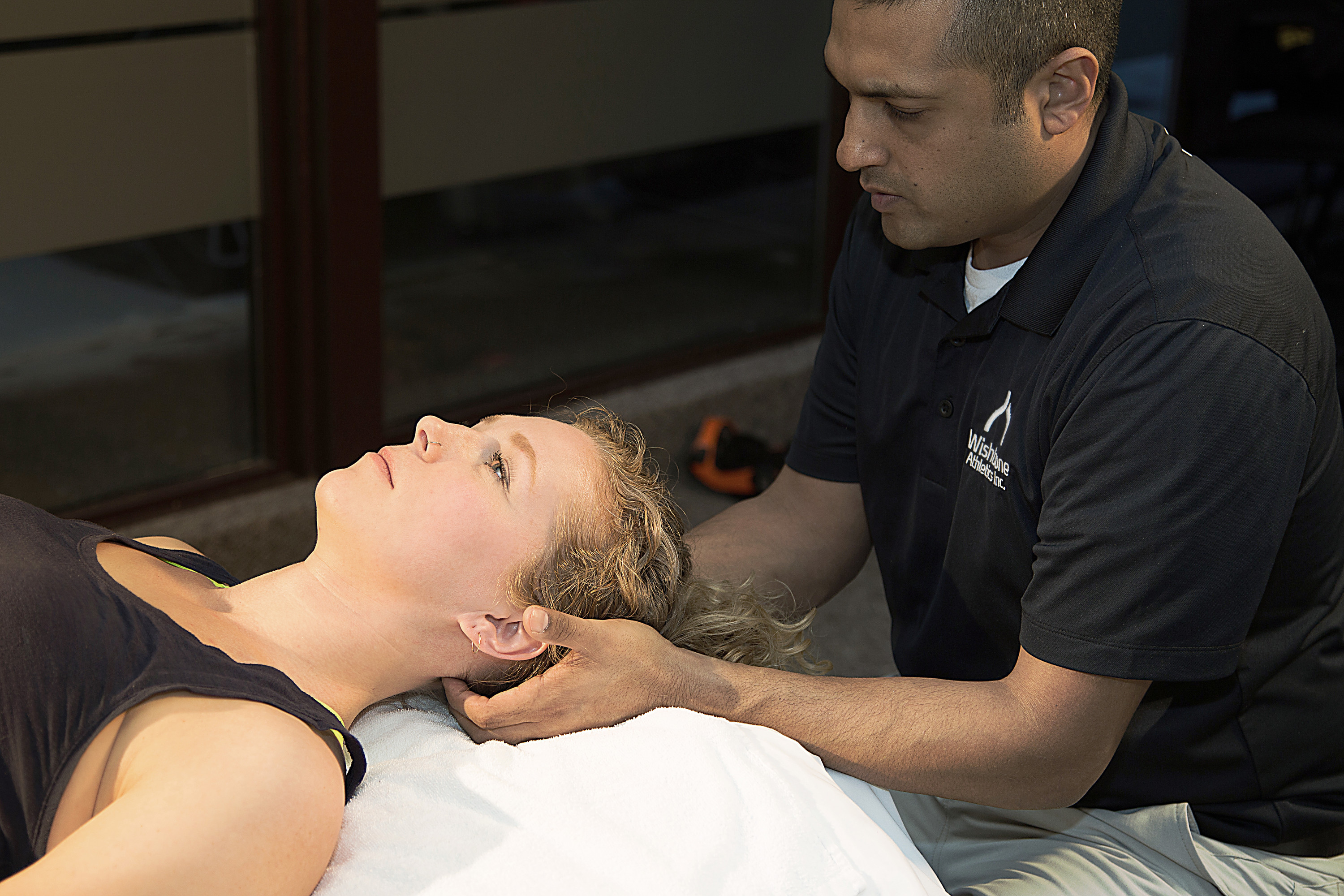 Physiotherapist working on a patient's neck